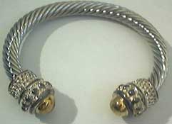 Detailed gold capped end wrist torc